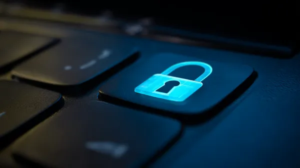 উজ্জ্বল লগইন প্রম্পটে আলোকিত একটি ল্যাপটপ—যা TAS71–এর সুরক্ষিত প্রবেশব্যবস্থাকে নির্দেশ করে।